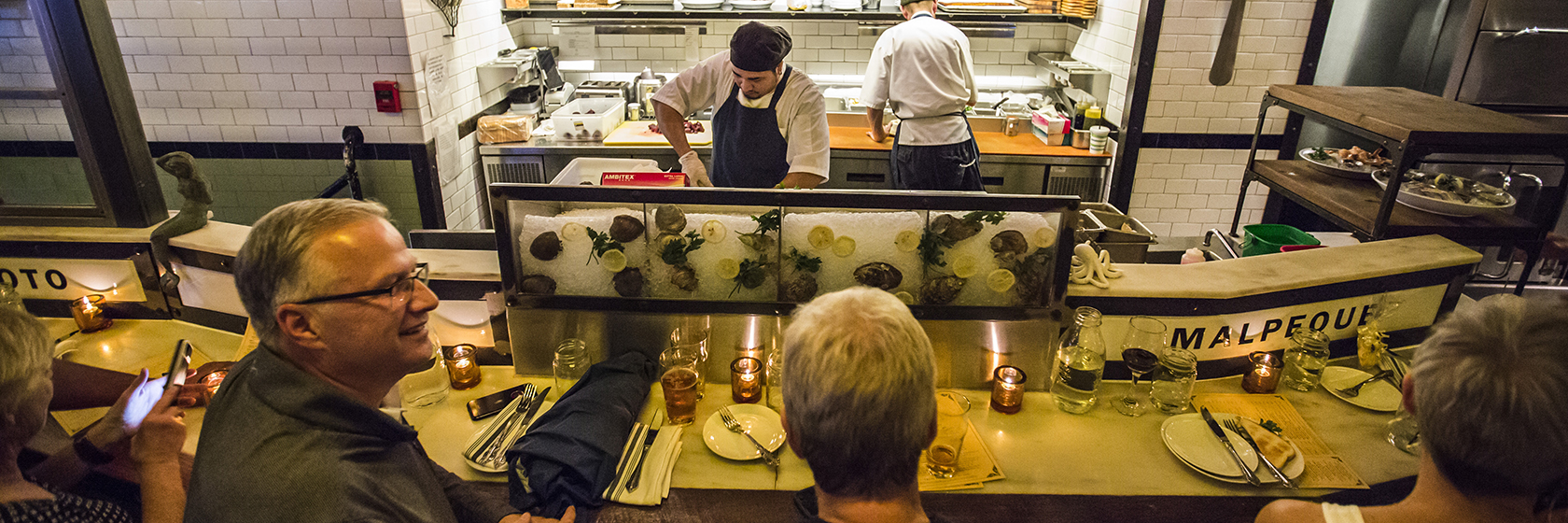 people eating at bar