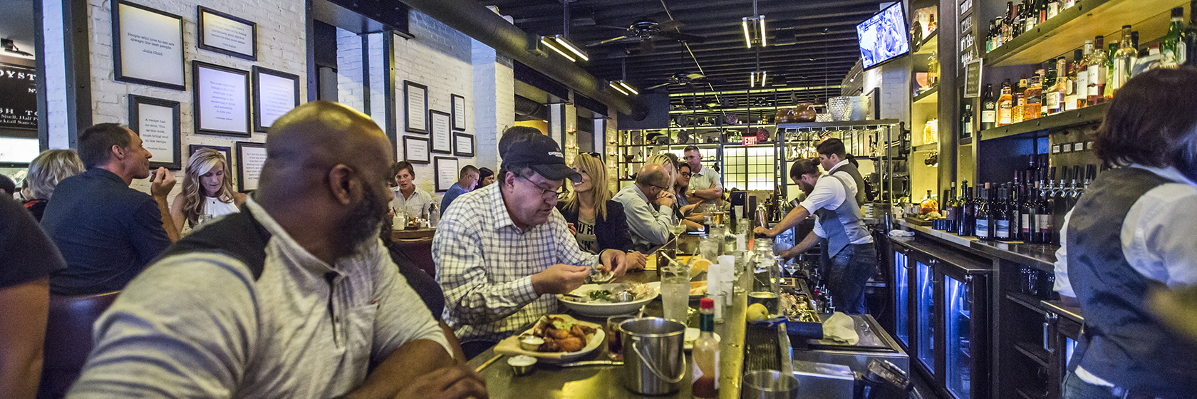 guests eating at bar