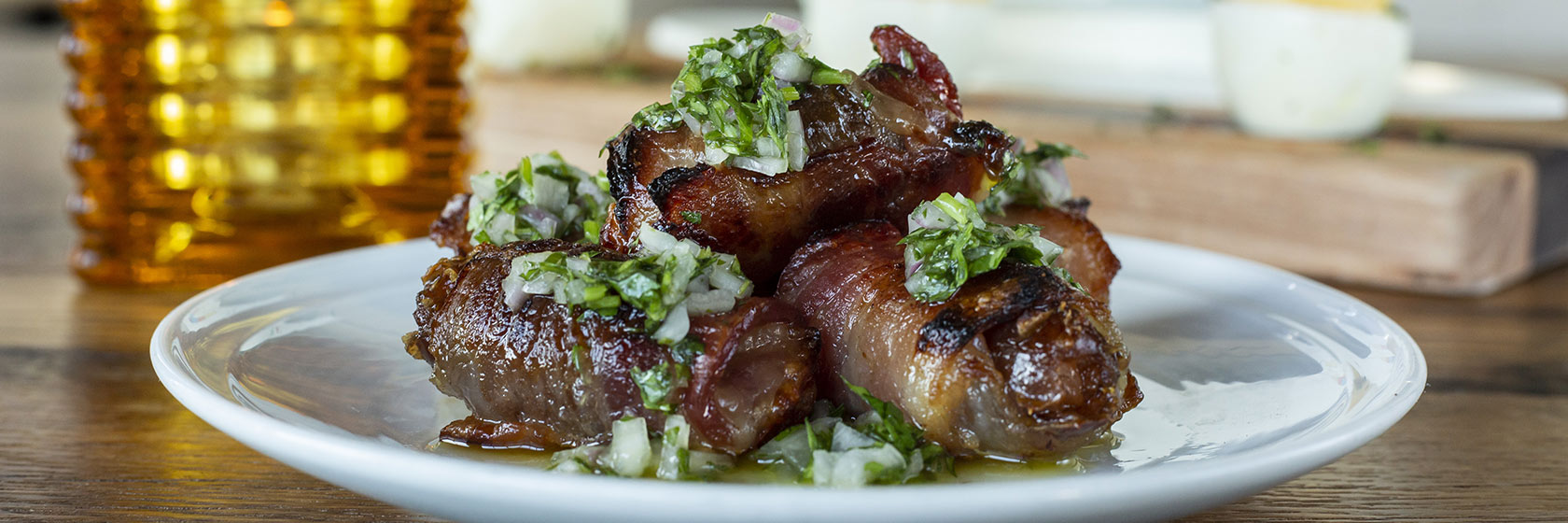 Plated Devils On Horseback appetizer