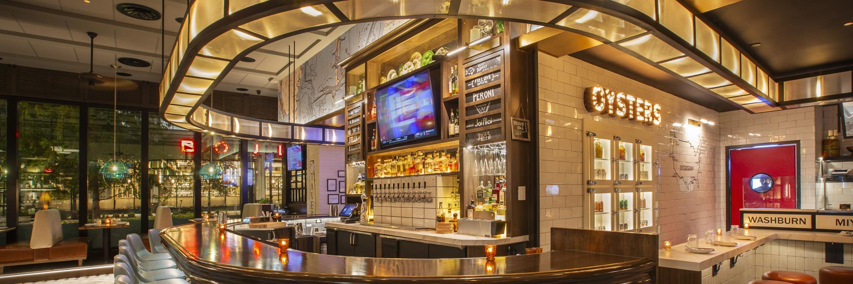 The curved bar and the Oyster Bar at The Pearl at Water Street in Tampa, Florida.